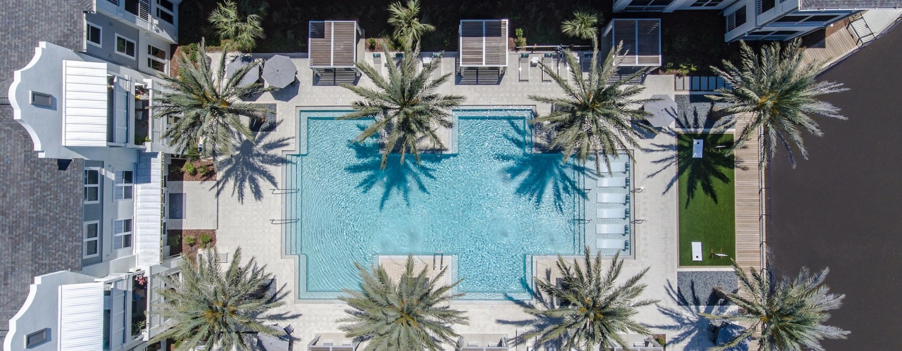 pool showing reclining seating and nearness to property buildings